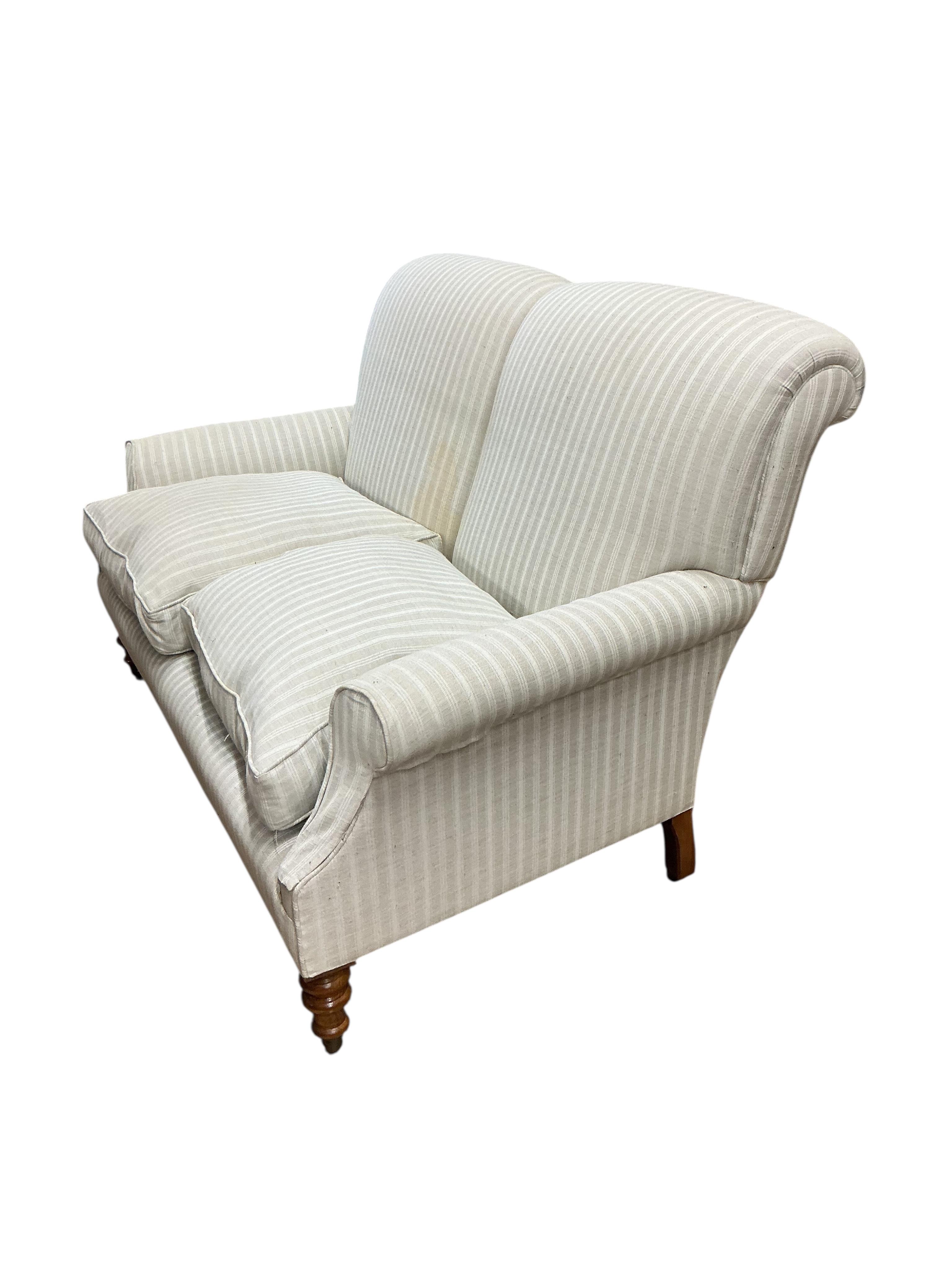 A Victorian style two seater sofa in the style of Howard & Sons, width 150cm, depth 90cm, height 88cm